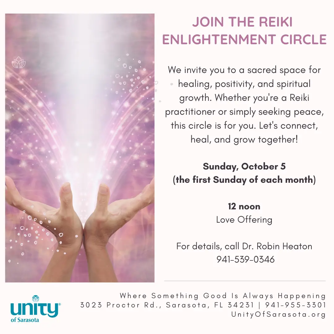 Hands raised towards radiant light symbolizing Reiki energy and healing.